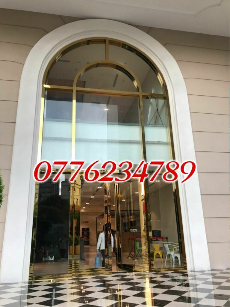 cửa kính cường lực khung inox mạ vàng báo giá thi công cửa công inox